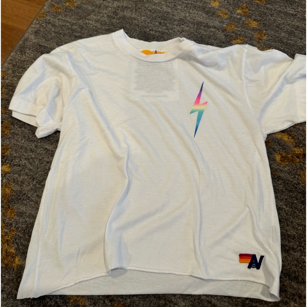 White aviator nation tee with bolt in corner